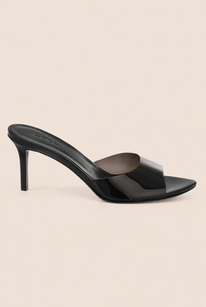Femi - Tacones de aguja negros con tira transparente